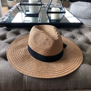 Tan hat with black ribbon w/ bow
